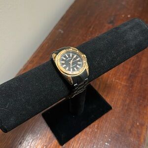 Anne Klein black wrist watch with gold accents